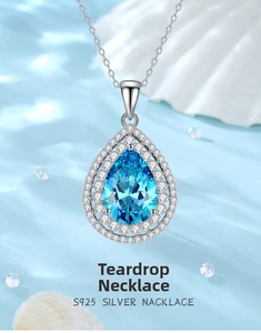 Macro shot of S925 silver waterdrop necklace with blue aquamarine gemstone and diamonds