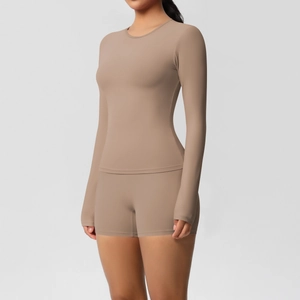Close-up of tight-fitting long-sleeve top and high-waist yoga shorts in mocha brown