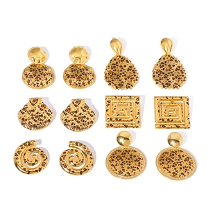 6 pairs of vintage leopard print gold earrings set with shell and spiral shapes
