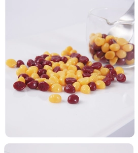 Macro shot of miniature chestnut food models with yellow and red smooth texture finish
