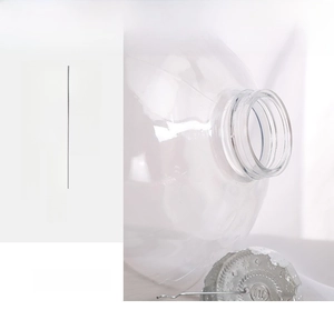 Close-up of food-grade clear PET storage jar with secure silver screw cap and thread detail