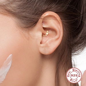 S925 sterling silver gold-plated cartilage hoop earring with three diamonds on model