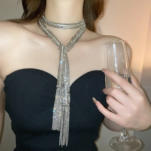 Detailed close-up of sparkling rhinestone tassel necklace with multi-layer wrap design