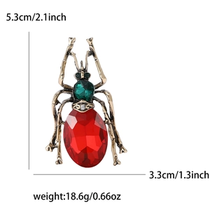Detail view of insect brooch with dimensions 5.3x3.3cm and red oval gemstone inlay