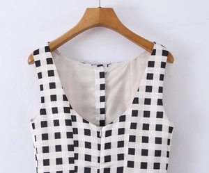 Detail view of black and white plaid sleeveless dress with back zipper on hanger