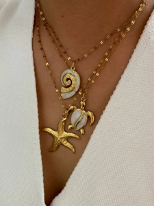 Detailed layered necklace featuring gold starfish, enamel sea turtle and shell pendants