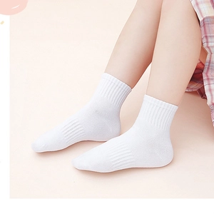 White cotton athletic crew socks for children with ribbed cuffs and breathable mesh texture