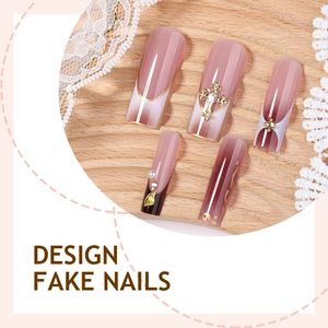French press-on nails with 3D leopard print, pearls, and golden cross jewelry accents