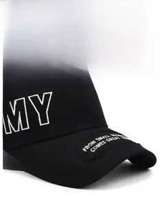 Detail of white MY embroidery and side lettering on black cotton canvas baseball cap