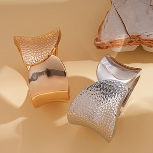 Irregular wrinkled metal open cuff bracelet with hammered texture in gold and silver