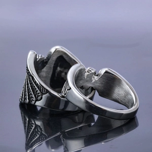 Retro stainless steel biker rings featuring carved wings and wheel motifs for men and women