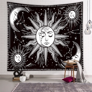 Bohemian sun and moon tapestry hanging on a white brick wall with cozy room decor