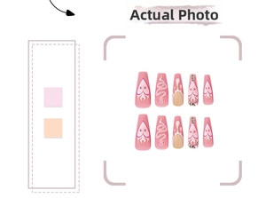 Detailed macro view of matte pink Y2K press-on nails with 3D snake patterns and rhinestones