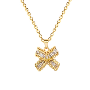 Elegant gold titanium necklace featuring an X-shaped pendant with cubic zirconia inlay