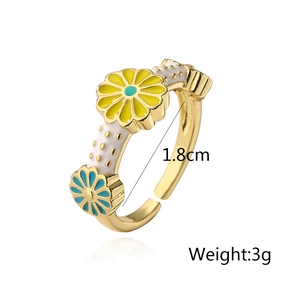 Macro detail of Bohemian enamel daisy ring with 1.8cm inner diameter gold finish