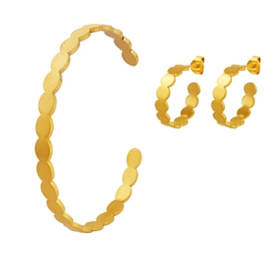 Minimalist gold oval link jewelry set including an open cuff bracelet and hoop earrings