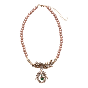 Vintage necklace with purple pearls, green pendant and rhinestone leaf accents