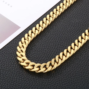 Detailed macro view of 13mm gold plated cuban link chain for men with high polished finish