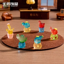 Miniature colorful cactus ornaments in a cozy bar scene setting for desktop decor