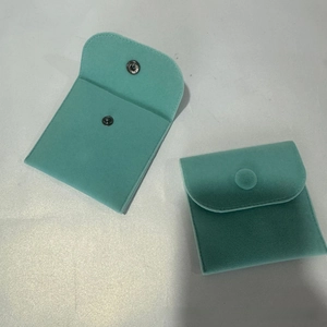 Detail view of Tiffany blue microfiber jewelry pouches with secure snap button closure