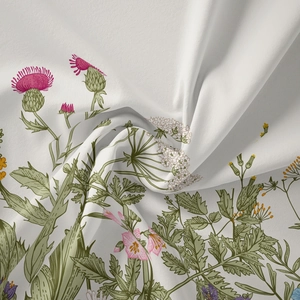Detailed close-up of bohemian botanical tapestry fabric with colorful wildflower patterns