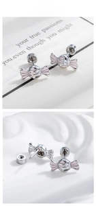Detailed view of pink candy cartilage stud earring with center zircon and screw back