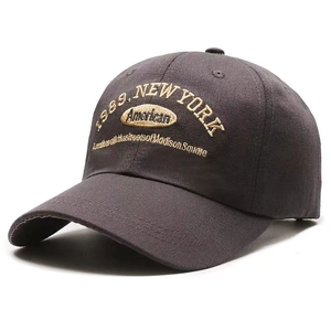 Detail of vintage 1989 New York embroidery on dark charcoal grey cotton baseball cap