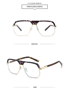 Detail of pilot sunglasses with gold metal frame and pink floral acetate temples