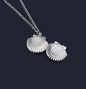 Polished silver stainless steel shell locket necklace with a delicate metal chain