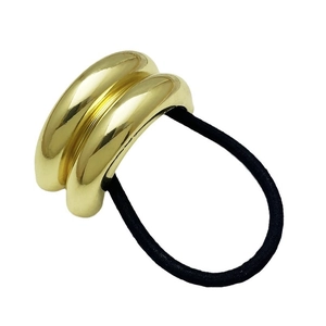 Minimalist double gold metal tube elastic hair tie with polished mirror finish on white background