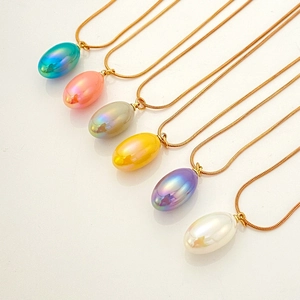 Group shot of colorful teardrop pendants on gold snake chains in six vibrant pearlescent hues