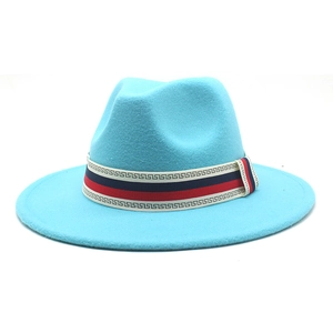 Detail view of sky blue wool fedora with retro red and blue striped decorative band