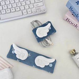 Blue denim cable organizer with plush wing design shown holding white data cables