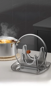U-shaped pot lid holder with wide drip tray on a modern grey marble countertop