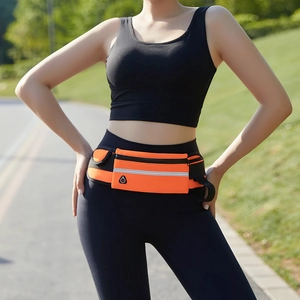Close-up of bright orange running belt with reflective strip and earphone port