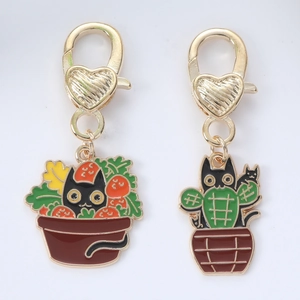 Cute enamel cat keychains in plant pots with gold heart-shaped lobster clasps