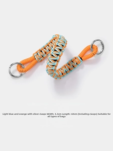 Detail of woven bag strap in blue and orange with silver rings and dimensions