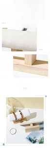 Detail of wooden jewelry stand showing white microfiber texture and thick T-bar base stability