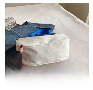 Detail shot of the wear-resistant thickened bottom of this white nylon tote shoulder bag