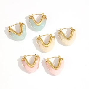 Three pairs of elegant heart-shaped resin hoop earrings in blue, beige, and pink colors
