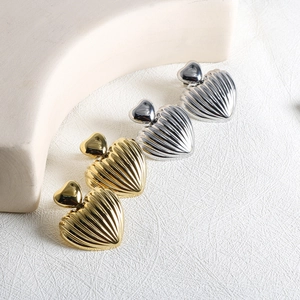 Modern shell-textured heart earrings set in gold and silver finish stainless steel