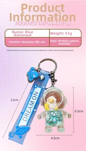 Blue astronaut liquid quicksand keychain with silicone wrist strap and planet charm
