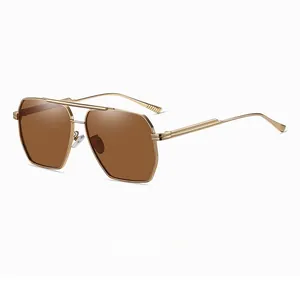 Close-up of gold aviator sunglasses with brown lenses and slim metal temples