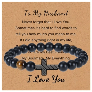 Detail of beaded bracelet with tiger eye stone on message card for husband