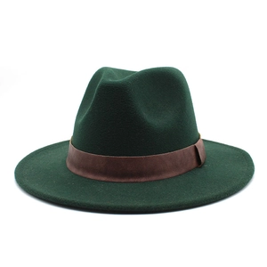 Detail of dark green wool felt jazz hat with a brown leather strap in British style