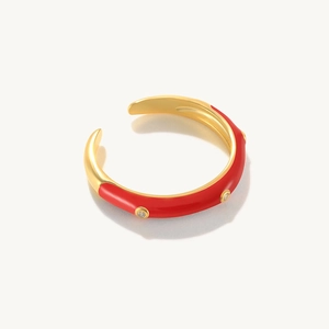 Detail of gold and red enamel ring featuring micro-pave zircons and adjustable open band