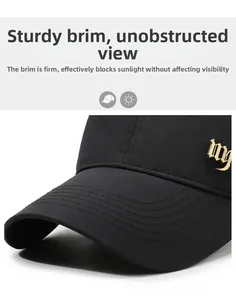 Detail of breathable baseball cap featuring sturdy brim and gothic gold metal side logo