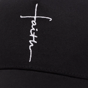Black baseball cap featuring white Faith cross embroidery on breathable twill fabric