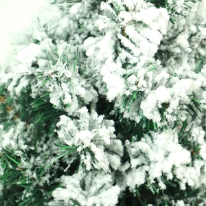 Mini green PVC Christmas tree with dense white snow flocking and natural wooden base