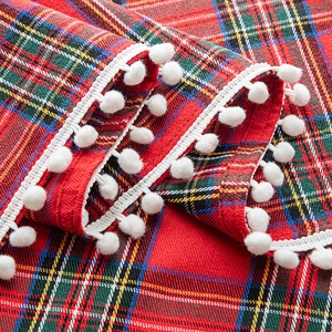 Christmas red plaid curtain with festive snowflake patterns and white pom-pom fringe edges